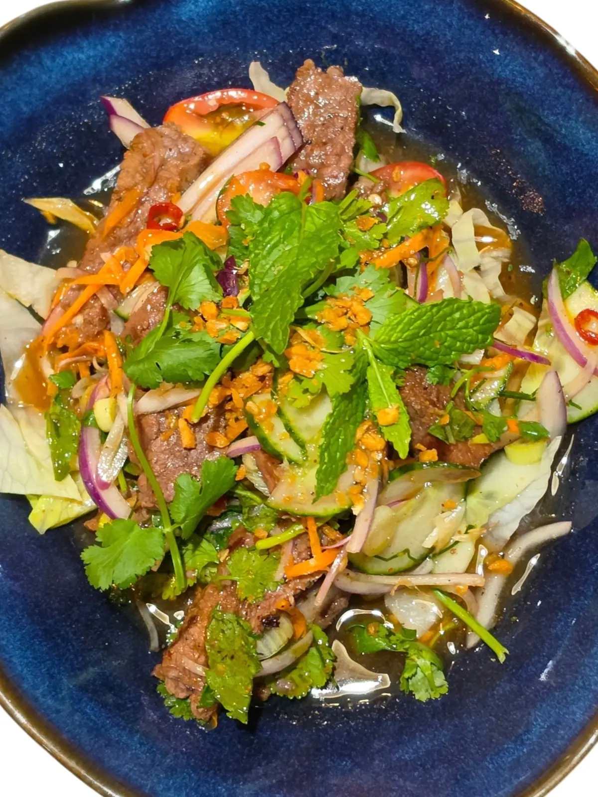 Yum Neua Yang — Thai beef salad with fresh herbs at Sabannga